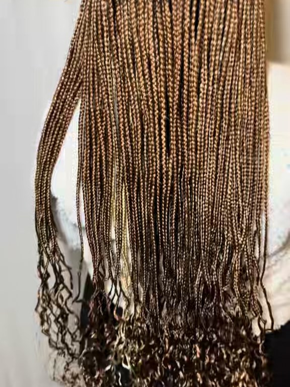Honey-toned braids finished with curled ends